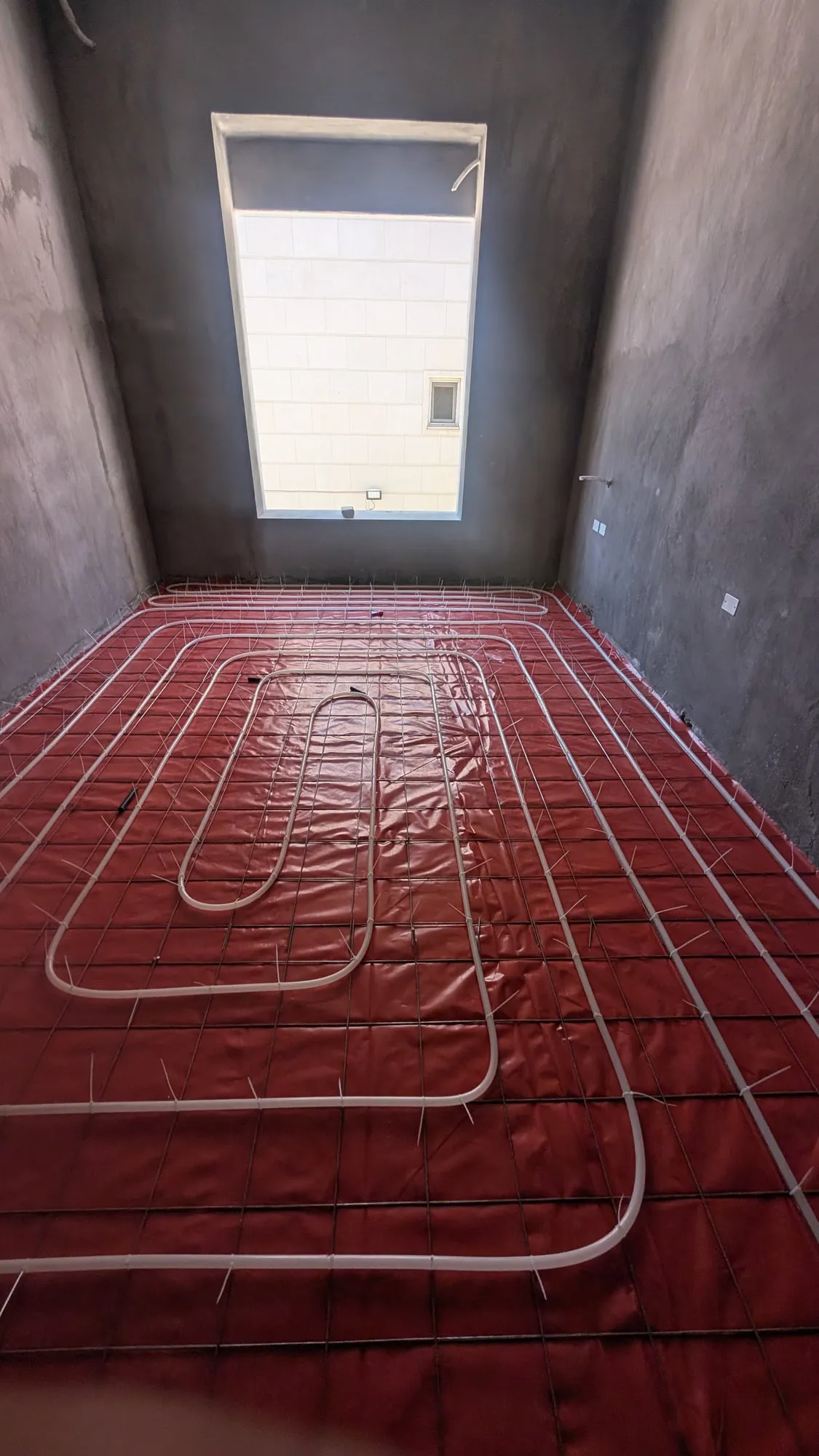 Underfloor heating pipework in a building under construction